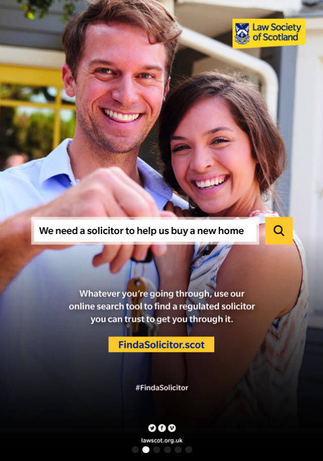 Young, happy couple holding house keys