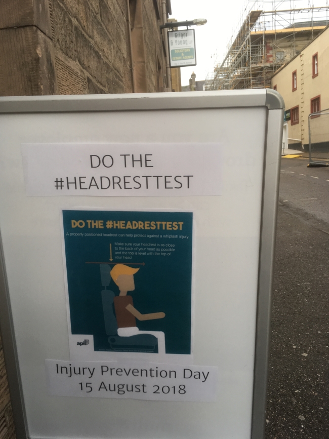 Sign outside Grigor & Young LLP, Elgin, promoting Injury Prevention Day 2018