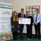 Grigor & Young LLP hand over a cheque to Moray Foodbank