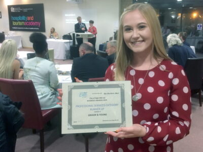 Lauryn of Grigor & Young with G&Y's runners-up certificate in the Professional Services category at the Elgin BID Business Awards 2019