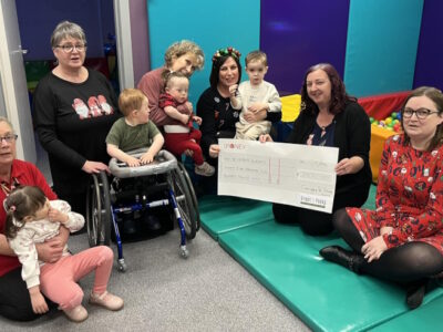 Carol-and-Suzanne-GnY-Present-Cheque-to-Ladybird-Development-Group-Lossiemouth