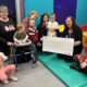 Carol-and-Suzanne-GnY-Present-Cheque-to-Ladybird-Development-Group-Lossiemouth